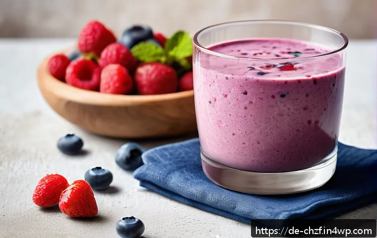 식재료를 활용한 스무디와 주스 레시피 - A vibrant and fresh morning breakfast scene featuring a creamy mixed berry and oat smoothie in a cle...